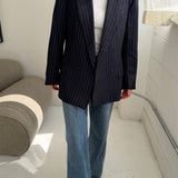 Double-breasted navy pinstriped button back blazer