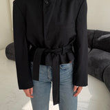 Pinstriped black and navy belted blazer