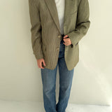 Green houndstooth and solid blazer