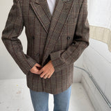 Double-breasted green houndstooth with an overcheck