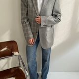 Contrasted blazer in grey checkered tones