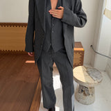 Grey pinstriped suit with vest
