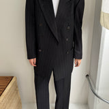 Double breasted grey suit with green pinstripes