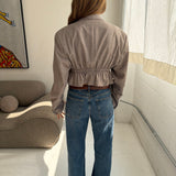 Cinched waist cropped blazer in textured pale grey