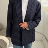 Double-breasted navy pinstriped button back blazer