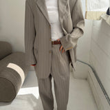 Light grey pinstriped suit