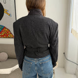Belted blazer in speckered black wool
