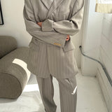 Light grey pinstriped suit