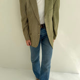 Green houndstooth and solid blazer