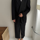 Double breasted grey suit with green pinstripes