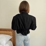 Cropped blazer with cinched waist in black
