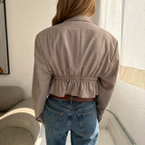 Cinched waist cropped blazer in textured pale grey