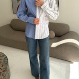 Blue with white and black stripes and white with blue and yellow stripes contrasted shirt