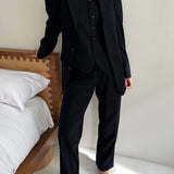 Navy pinstriped three piece suit