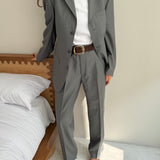 Pale grey pinstriped suit