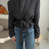 Belted blazer in speckered black wool