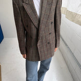 Double-breasted green houndstooth with an overcheck