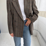 Double-breasted green houndstooth with an overcheck