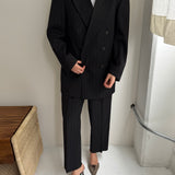 Double breasted grey suit with green pinstripes