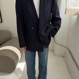 Double-breasted navy pinstriped button back blazer