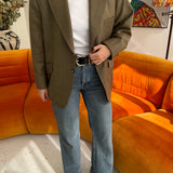 Green with plaid blazer