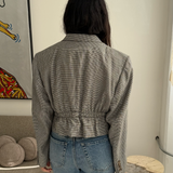Cinched waist cropped blazer in black and white houndstooth with a subtle overcheck