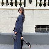 Navy pinstriped skirt suit